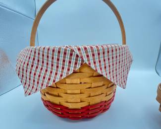 To Longaberger Baskets. Two woven baskets featuring one with a checked fabric lining. The larger basket has a red and natural wood design, while the smaller basket is a plain natural wood finish.
Note photos for details and condition. Measurements taken under field conditions are approximate within 1/2". Feel free to reach out with any questions.
Items are heavy and we do not assist with loading. Be sure to bring adequate help and a large enough vehicle for large items. If you need assistance, call Denny for an estimate for delivery. (720) 393-0204.