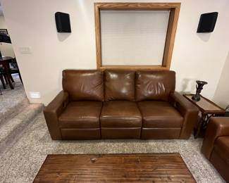 Includes a brown leather sectional sofa set. Item condition shows some use but overall well-maintained. Ideal for living rooms or family areas. This is the Durango Leather Sofa and Love Seat from Furniture Row, purchased in the last few years. It is in very good used condition with some scratching that would be expected for a family room sofa.
Coffee and side tables not included.