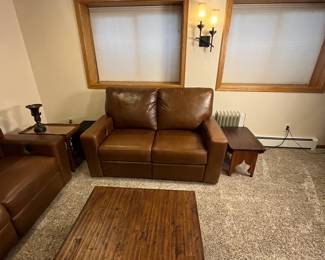 Includes a brown leather sectional sofa set. Item condition shows some use but overall well-maintained. Ideal for living rooms or family areas. This is the Durango Leather Sofa and Love Seat from Furniture Row, purchased in the last few years. It is in very good used condition with some scratching that would be expected for a family room sofa.
Coffee and side tables not included.