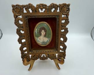 Antique Miniature Portrait. Vintage ornate picture frame featuring a hand painted portrait of a woman on porcelain. The frame is intricately designed with floral patterns and a gold finish, measuring approximately 6x8 inches.
Note photos for details and condition. Measurements taken under field conditions are approximate within 1/2". Feel free to reach out with any questions.