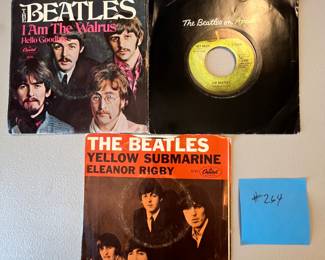 Includes three classic singles: 'I Am The Walrus / Hello Goodbye' (1967, Capitol Records), 'Get Back' (Single with Apple label), and 'Yellow Submarine / Eleanor Rigby' (1966, Capitol Records).
Note photos for details and condition. Measurements taken under field conditions are approximate within 1/2". Feel free to reach out with any questions.