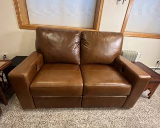 Includes a brown leather sectional sofa set. Item condition shows some use but overall well-maintained. Ideal for living rooms or family areas. This is the Durango Leather Sofa and Love Seat from Furniture Row, purchased in the last few years. It is in very good used condition with some scratching that would be expected for a family room sofa.
Coffee and side tables not included.