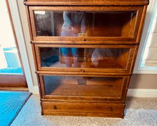 Antique Oak Barrister Cabinet Set from The Globe-Wernicke Co.
This is an antique barrister cabinet with three glass-fronted compartments, crafted from oak. Made by Globe Wernicke Co. - Likely from the early 20th century. Features a lower drawer for additional storage. Model number D 81 299.
Note photos for details and condition. Measurements taken under field conditions are approximate within 1/2". Feel free to reach out with any questions.
Items are heavy and we do not assist with loading. Be sure to bring adequate help and a large enough vehicle for large items. If you need assistance, call Denny for an estimate for delivery. (720) 393-0204.
