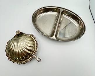 Antique Butter Dish and Divided Serving Tray. This is a truly unique antique butter dish in the shape of a clam shell with a glass insert and a serving utensil. It is silver plated with some tarnishing and loss of finish. This lot also includes a stainless divided serving tray in excellent condition.
Note photos for details and condition. Measurements taken under field conditions are approximate within 1/2". Feel free to reach out with any questions.