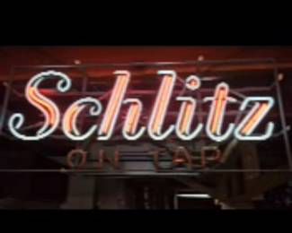 Vintage Schlitz on Tap neon sign from the 1970s. Manufactured by the Everbrite Electric Signs, featuring vibrant neon colors and a sturdy construction. Approximately 28”wide x 12”tall x 6” deep