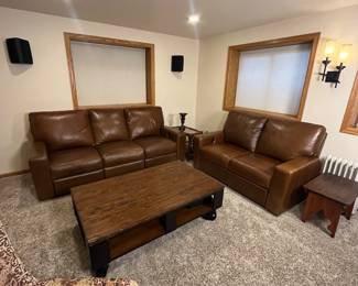 Includes a brown leather sectional sofa set. Item condition shows some use but overall well-maintained. Ideal for living rooms or family areas. This is the Durango Leather Sofa and Love Seat from Furniture Row, purchased in the last few years. It is in very good used condition with some scratching that would be expected for a family room sofa.
Coffee and side tables NOT included.