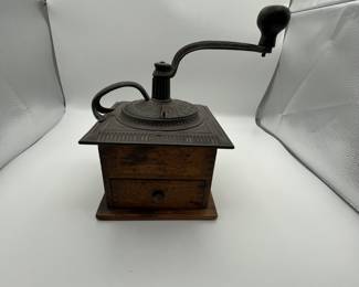 Antique Coffee Grinder. Antique wooden and metal coffee grinder with a hand-crank mechanism, featuring an ornate design. Likely made in the early 1900s.
Note photos for details and condition. Measurements taken under field conditions are approximate within 1/2". Feel free to reach out with any questions.
Items are heavy and we do not assist with loading. Be sure to bring adequate help and a large enough vehicle for large items. If you need assistance, call Denny for an estimate for delivery. (720) 393-0204