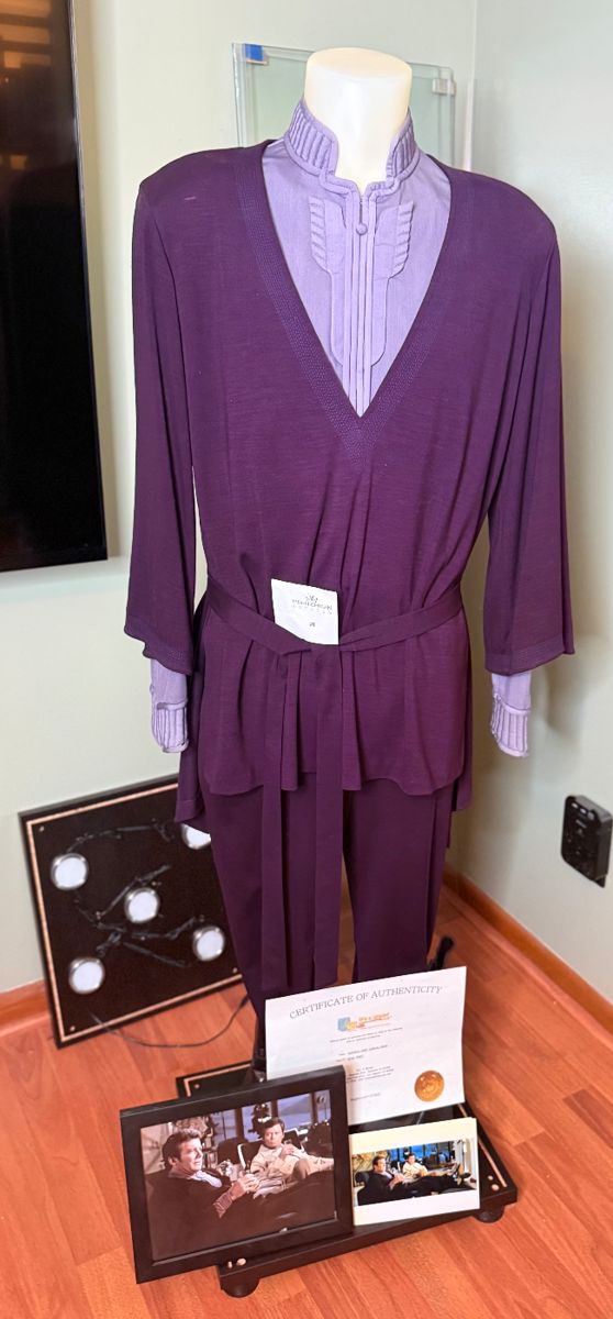Admiral Kirk Star Trek costume from film/TV with official proof of purchase/ COA. Registered number - ST12622 William Shatner
Condition - very good - small amount of dust has collected on outfit. Lighted glass display cabinet is not complete (missing one side glass panel).
PLEASE NOTE: IF high bidder cannot pick up this item, we ARE NOT shipping the Mannequin or the display case. We will only ship the official costume, boots, COA’s and photograph of Shatner wearing the costume.
Sold as is. No damage to actual costume. Comes with photo of William Shatner wearing costume.
Jacket, under shirt, pants, boots & display cabinet included.