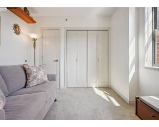 another shot of sofa, wall decor, shelves and side of bench