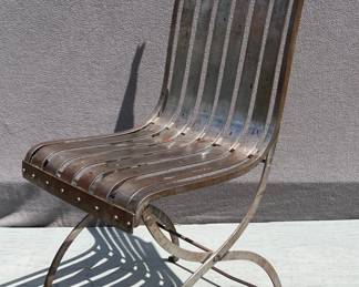 Industrial era brushed steel single side chair with rivets