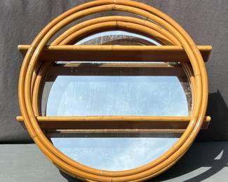Vintage rattan round mirror with shelves, labeled Ritts Co, Los Angeles