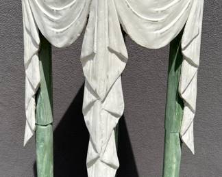 Tall wood carved stand with draped curtain accent on top