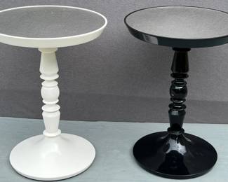 Two black and white mirrored round pedestal stands