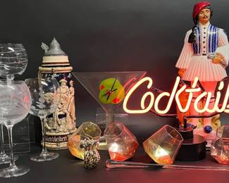 Cocktail glasses, neon sign, tankard, Ouzo decanter