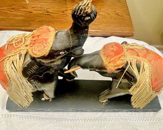 Vintage wooden elephants with decorative saddle cloths and tassels from India