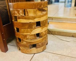 Southeast Asia decorative side table constructed from stacked wood slices. Emphasizes natural materials & minimalist forms.