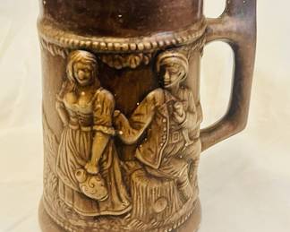 This is a vintage 7-inch ceramic beer stein, likely made in Japan, with a German-style design.