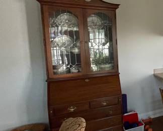Amana colonies secretary, storage basket, brocade upholstered rocker all for sale. Also the crystal and china in secretary for sale