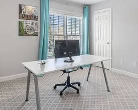 IKEA adjustable table. Teal drapes.