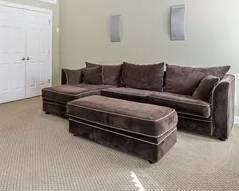 Suede Sleeper sofa with chaise and rolling ottoman