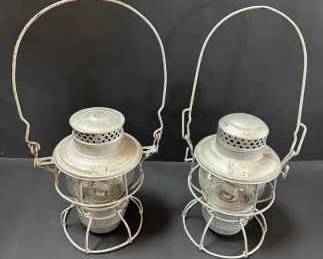 Pair of Vintage RailroadStyle Metal Lanterns with Protective Cages