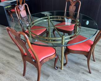 Beautiful brass and glass round table with 6 Hickory reupholstered chairs (only 4 shown). All for $1200. Call Patty (or text) with offers to buy and setup a pickup. We will make pickup easy for you! 847-772-0404.