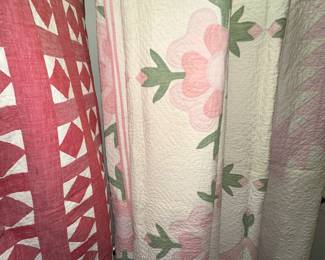 Several antique quilts