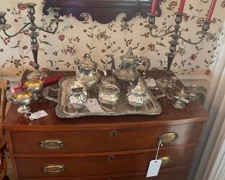 Bow front chest , sterling tea service Strasberg