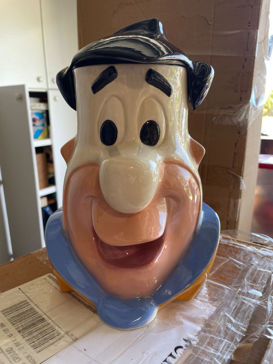 Fred Flintstone cookie jar. One of many in a large Flintstone collection that includes vintage toys, stuffed animals, sketches, etc.