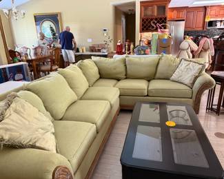 Large sectional couch and coffee table.