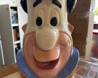 Fred Flintstone cookie jar. One of many in a large Flintstone collection that includes vintage toys, stuffed animals, sketches, etc.