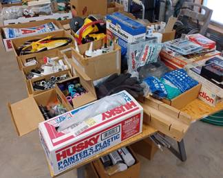 2 tables full of shop supplies