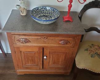 1800s cabinet with solid marble top, needlepoint chair, pottery from Isreal.
