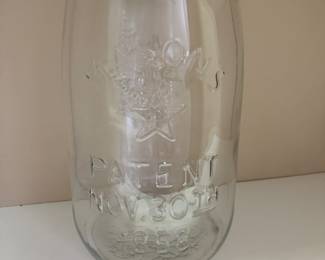 It’s hard to read, but the jar says Mason‘s Patent Nov.  30, 1858. With a star underneath the word Mason’s. The jar measures approximately 14 1/2 inches tall. The diameter of the opening is approximately 4” and the diameter of the bottom of the jar is approximately 8”. 