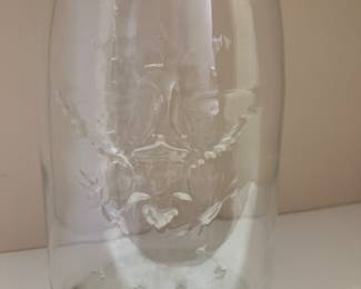 This is the back of the jar. It shows an eagle with three stars above it and four stars below it.  The front of the jar says Mason‘s Patent Nov.  30, 1858. With a star underneath the word Mason’s. The jar measures approximately 14 1/2 inches 
