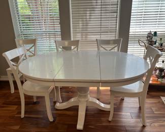 Kitchen table and chairs. The table has one leaf so if it’s taken out, it makes a circle instead of the oblong table.