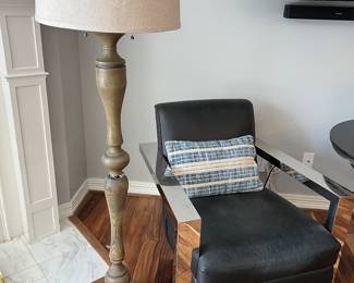 Chrome and black Restoration Hardware, leather chair, and nice floor lamp
