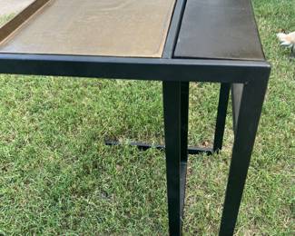 Very modern gold and black metal table