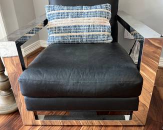 RESTORATION HARDWARE. $2300 black leather and chrome chair!