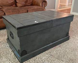 This wood trunk opens up in the center for great storage