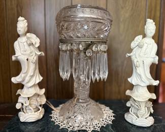 Guan Yin figurines flanking American brilliant table lamp