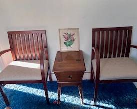 Classic mid-century modern chairs and hideaway side table