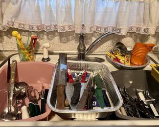 Serving utensils / knives of all sizes and baking, icing and cutting, and tongs too.