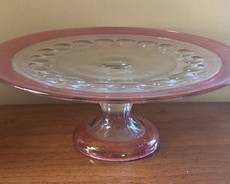 Vintage Kings Crown Cranberry Flash Glass Pedestal Cake Plate
Measures 5 inches tall and 12 inches in diameter.