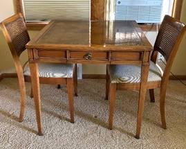 Charming Vintage Table with Two Chairs
Lovely dinette set for a smaller space. The table features a beautiful surface and single drawer. Measures 31 x 31 x 28.5 inches. IN
In overall very good condition with light vintage wear