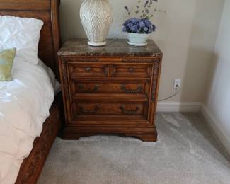 One of two night stands that are part of bedroom set and they have a marble like top. Size is 34 x 20.