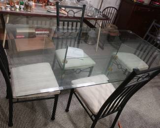 glass top table and chairs