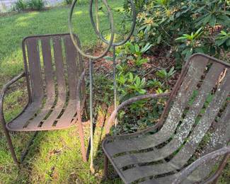 Vintage metal chairs and garden sculpture