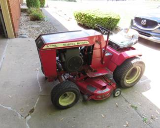Wheel Horse C-125 in mowing condition