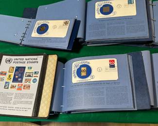 Stamp replicas on each page are either 14 or 23 Karat Gold. Also shown a collectors album with 2 pages of 1967 United Nations stamps.